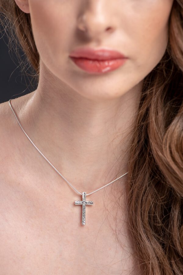 Diamond cut silver cross