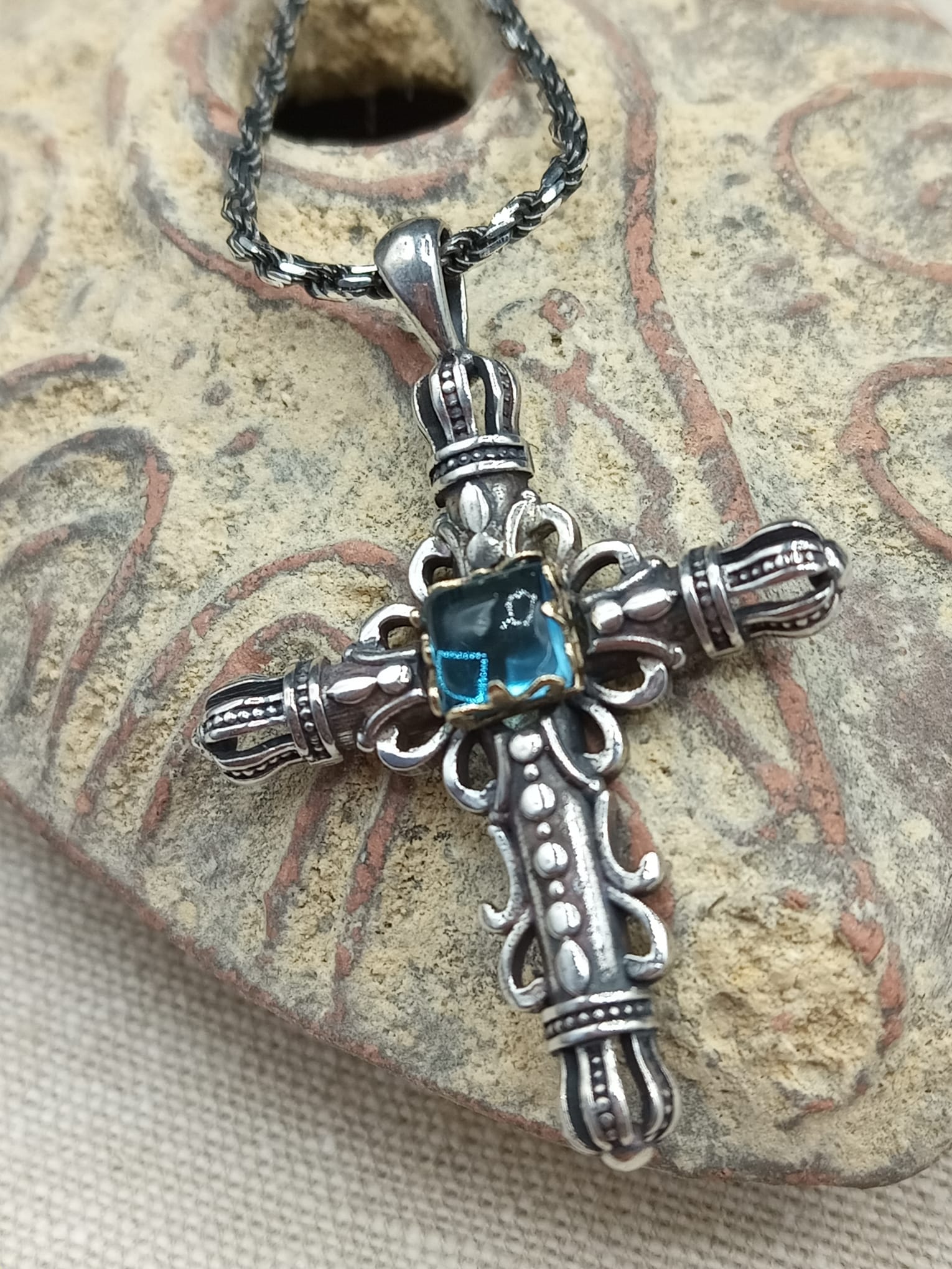 Silver & 14 Karat Cross set with Blue Topaz