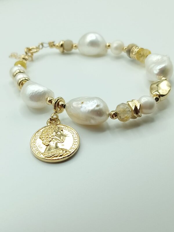 Designer Large pearl bracelet with A touch of Gold elements & semi precious stones